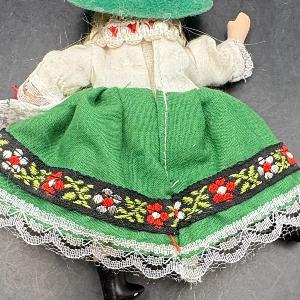 Traditional vintage porcelain doll with Green Hat and Dress